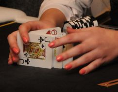 A croupier shuffles cards