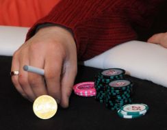 A player smokes a cigarette