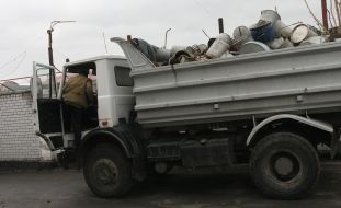 A driver sits down in the booth of truck