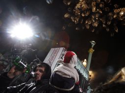 Boy drinks champagne from a bottle