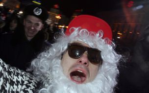 Young man in the suit of the Father Frost