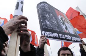 The participant of picket holds a placard