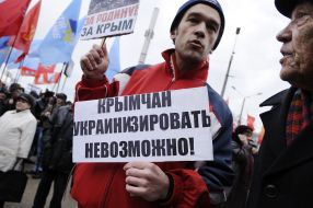 The participant of picket holds a placard