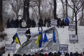 Young people blow off placards