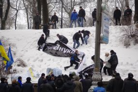 Young people blow off placards