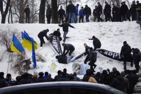 Young people blow off placards