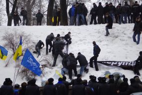 Young people blow off placards