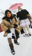 Participant of celebration in the suit of Baba-Yaga