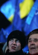 A boy listens appearance of the leader Party of regions