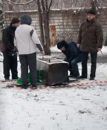 The employees of militia examine the unsealed safe