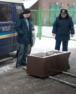 The employees of militia examine the unsealed safe