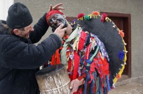A man stains by soot of young man