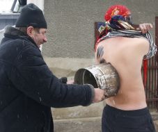 A man stains by soot of young man