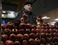 A man selling pomegranates