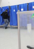 A young man come in a polling-booth
