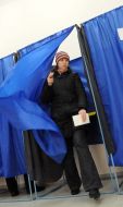 Girl goes out from a polling-booth