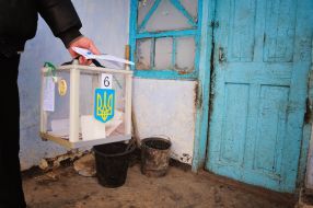 Election committee’s member carries a portable ballot-box