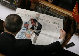 Igor Alekseyev reads the newspaper