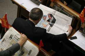 Igor Alekseyev reads the newspaper