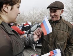 Girl hands out flags