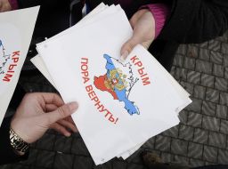 Girl hands out stickers