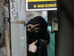 Young people stand near the bookstore of ”Syayvo”