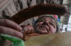 The participant of picket holds sausage