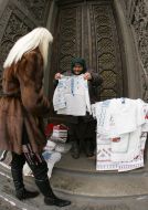 An old woman sells vyshyvanky