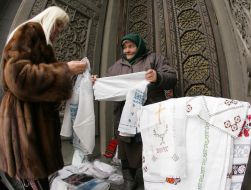 An old woman sells vyshyvanky