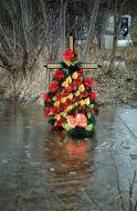 Cross on the flooded cemetery