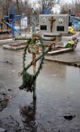 Cross on the flooded cemetery