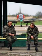 The pilots sit on the bench