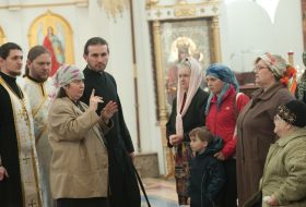 A parishioner conducts the mystery the sacrament of Anointing