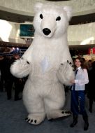 The participant of fair in the suit of bear