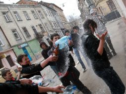 A young man pouring water girl