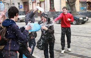 A young man pouring water girl