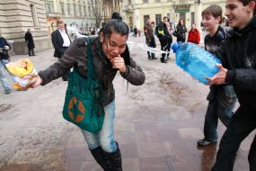 A young man pouring water girl