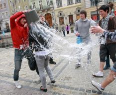 A young man pouring water girl