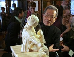 Comada Ryusi considers the sculpture ”Mother, which feeds the baby”