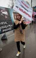 A girl carres a poster