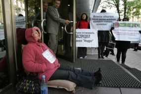 Depositor ”Nadra Bank” sits at the entrance