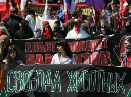 Young people hold placards