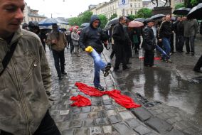 Torn red flags on earth