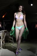 A model demonstrates a swimming suit