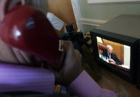 Изображение Николая Азарова на экране телевизора