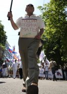 Elderly man with a placard