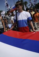 Young man in a sport shirt with representing the flag of Russia
