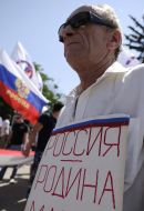 Elderly man with a placard
