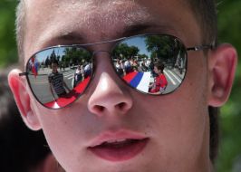 A young man in spectacles