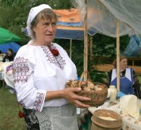 A woman holds mushrooms